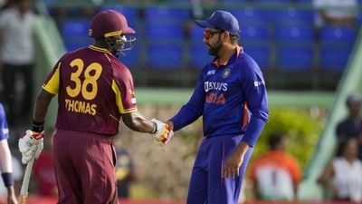 Rohit Sharma (R) with Devon Thomas (AP)