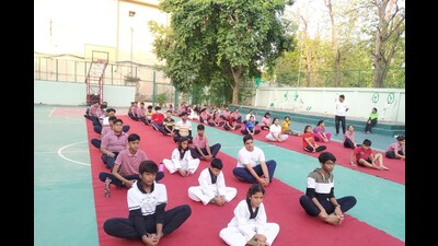 School students performing yoga in Prayagraj. (HT file) School students performing yoga in Prayagraj. (HT file)