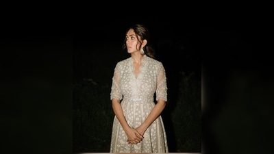 Mrunal Thakur's ivory anarkali set features intricate sequins work all over. The outfit comes with a matching cropped cape. (Instagram/@mrunalthakur) Mrunal Thakur's ivory anarkali set features intricate sequins work all over. The outfit comes with a matching cropped cape. (Instagram/@mrunalthakur)