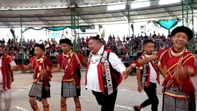 The image, taken from the video, shows Nagaland minister Temjen Imna Along shaking a leg at the traditional festival. (Twitter/@AlongImna) The image, taken from the video, shows Nagaland minister Temjen Imna Along shaking a leg at the traditional festival. (Twitter/@AlongImna)