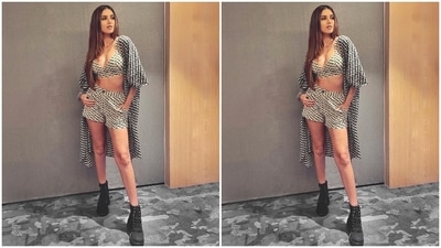 This is another coordinated look that Tara wore for promoting Ek Villain Returns. And it impressed us too. She chose a black and off-white abstract printed bralette and high-waist shorts set, teamed with a half-sleeved oversized jacket. She left it open to show off the outfit and flaunt her toned midriff. (Instagram) This is another coordinated look that Tara wore for promoting Ek Villain Returns. And it impressed us too. She chose a black and off-white abstract printed bralette and high-waist shorts set, teamed with a half-sleeved oversized jacket. She left it open to show off the outfit and flaunt her toned midriff. (Instagram)