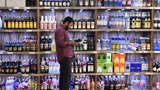 Liquor shop owners have to get their liquor permit after the excise department approves their labels for the sale of each bottle.(HT Photo)