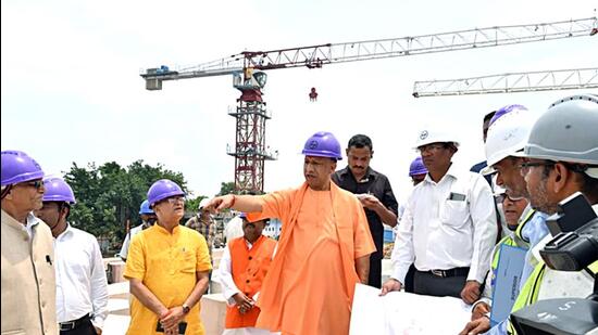 Uttar Pradesh Chief Minister Yogi Adityanath inspects the Ram Temple construction site in Ayodhya on Sunday.  (ANI)