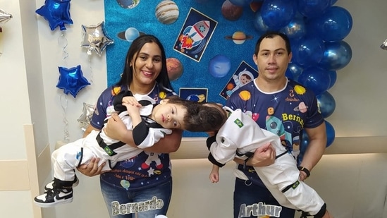 Handout picture released by Rio de Janeiro's State Health Department shows Brazilian conjoined twins Bernardo (L) and Arthur (R) with their parents Adriely and Antonio Lima in Rio de Janeiro, Brazil.&nbsp;(AFP)