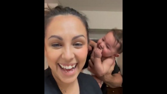 The adorable baby boy interrupting his mother's makeup tutorial with his laughter.&nbsp;(Instagram/@justine__rad)