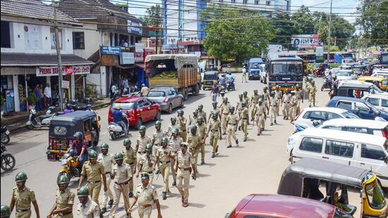 Puttur: Police personnel conduct a march past in Puttur, Mangaluru, Thursday, July 28, 2022. Tension prevailed in Puttur and other talukas of Dakshina Kannada district following the murder of Bharatiya Janata Yuva Morcha (BJYM) member Praveen, who was hacked to death on Tuesday evening, July 26, by unidentified people on a bike. (PTI)