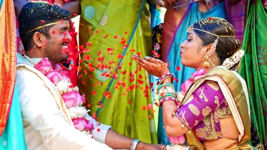 A big fat Indian wedding is not just about the glitz and glam, long dance performances and the delicious food but also those strange yet interesting rituals that will either leave you in splits or keep you questioning. Indian weddings can get very tiring but the rituals will surely keep you entertained. There are a few common ones like stealing the groom's shoe, nose pulling ritual and marrying a peepal tree. Here is a list of weird wedding rituals followed in different parts of India.(Unsplash)