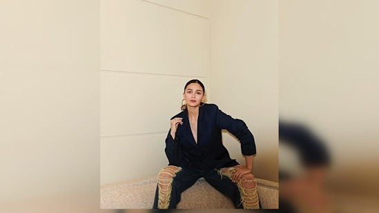 Alia Bhatt added the right hoop earrings, perfectly blending with her outfit for her chic yet casual look.(Instagram/@aliaabhatt)