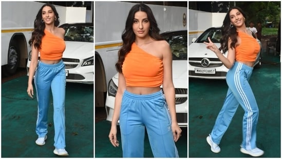 On Monday, Nora stepped out in Mumbai in a crop top and joggers set. The Dilbar Girl proved she is the queen of colour-block fashion with the ensemble and will definitely drive away all your Tuesday blues with this glamorous look. It is a perfect pick for running errands on a hot summer day or going on fun shopping dates with your girlfriends.(HT Photo/Varinder Chawla)