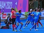 Indian players celebrate a goal against Canada during the Men's Pool B hockey match at the Commonwealth Games.(AP)