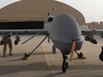 In this image provided by the U.S. Army, contactors from General Atomics load Hellfire missiles onto an MQ-1C Gray Eagle at Camp Taji, Iraq, on Feb. 27, 2011.&nbsp;