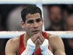 India's Mohammed Hussamuddin (Red) reacts after winning against Namibia's Ndevelo Tryagain Morning in the Men's Feather Quarter Final boxing match, at the Commonwealth Games 2022 (CWG)(PTI)