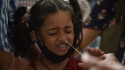 A health worker collects a swab sample for the Covid-19 test at the district hospital in Sector 30, Noida.