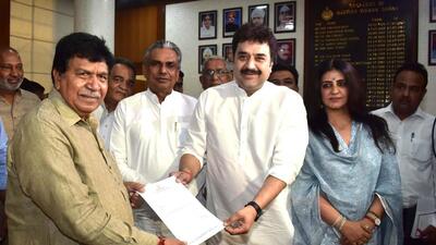 Kuldeep Bishnoi hands over his resignation to Haryana assembly speaker Gyan Chand Gupta as MLA from the Adampur constituency in Haryana, in Chandigarh on Wednesday. Flag-bearer of Bhajan Lal’s legacy, he will formally come under the wings of the BJP on Thursday. (Keshav Singh/HT) Kuldeep Bishnoi hands over his resignation to Haryana assembly speaker Gyan Chand Gupta as MLA from the Adampur constituency in Haryana, in Chandigarh on Wednesday. Flag-bearer of Bhajan Lal’s legacy, he will formally come under the wings of the BJP on Thursday. (Keshav Singh/HT)
