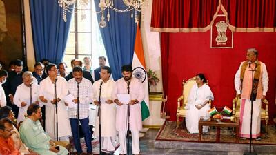 West Bengal governor LA Ganeshan administers the oath to the new cabinet ministers in presence of chief minister Mamata Banerjee at Raj Bhavan, in Kolkata on Wednesday. (ANI) West Bengal governor LA Ganeshan administers the oath to the new cabinet ministers in presence of chief minister Mamata Banerjee at Raj Bhavan, in Kolkata on Wednesday. (ANI)
