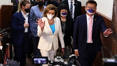 U.S. House of Representatives Speaker Nancy Pelosi walks next to Legislative Yuan Vice President Tsai Chi-chang as she leaves the parliament in Taipei.