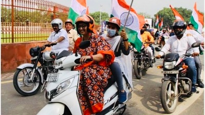 Union minister Smriti Irani riding a scooty during the Tiranga rally. (Twitter/@smritiirani) Union minister Smriti Irani riding a scooty during the Tiranga rally. (Twitter/@smritiirani)