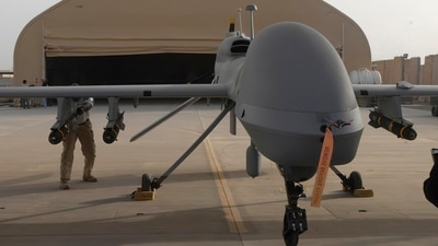 In this image provided by the U.S. Army, contactors from General Atomics load Hellfire missiles onto an MQ-1C Gray Eagle at Camp Taji, Iraq, on Feb. 27, 2011. (AP) In this image provided by the U.S. Army, contactors from General Atomics load Hellfire missiles onto an MQ-1C Gray Eagle at Camp Taji, Iraq, on Feb. 27, 2011. (AP)