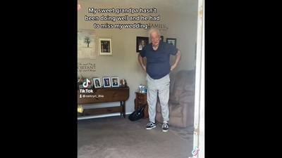 The image, taken from the video, shows the grandpa who got a surprise from her granddaughter after he missed her wedding. (Instagram/@camrynthie)