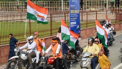 BJP MP Manoj Tiwari rides a motorcycle along with other MPs as he takes part in the 'Tiranga Bike Rally' for the MPs of all parties, at Red Fort in old Delhi, (PTI) BJP MP Manoj Tiwari rides a motorcycle along with other MPs as he takes part in the 'Tiranga Bike Rally' for the MPs of all parties, at Red Fort in old Delhi, (PTI)