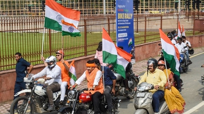 BJP MP Manoj Tiwari rides a motorcycle along with other MPs as he takes part in the 'Tiranga Bike Rally' for the MPs of all parties, at Red Fort in old Delhi,&nbsp; (PTI)