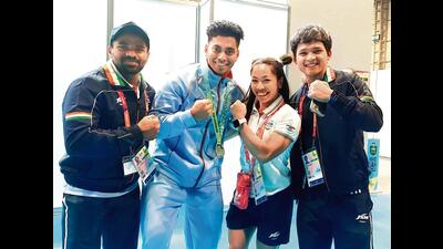Bronze medallist Gururaja Poojary with gold medallists Achinta Sheuli, Mirabai Chanu and Jeremy Lalrinnunga, at CWG 2022. (Photo: Twitter) Bronze medallist Gururaja Poojary with gold medallists Achinta Sheuli, Mirabai Chanu and Jeremy Lalrinnunga, at CWG 2022. (Photo: Twitter)