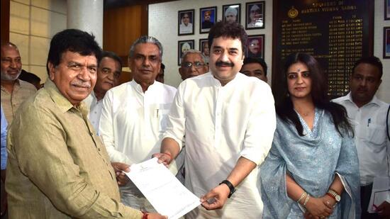 Kuldeep Bishnoi hands over his resignation to Haryana assembly speaker Gyan Chand Gupta as MLA from the Adampur constituency in Haryana, in Chandigarh on Wednesday. Flag-bearer of Bhajan Lal’s legacy, he will formally come under the wings of the BJP on Thursday. (Keshav Singh/HT)
