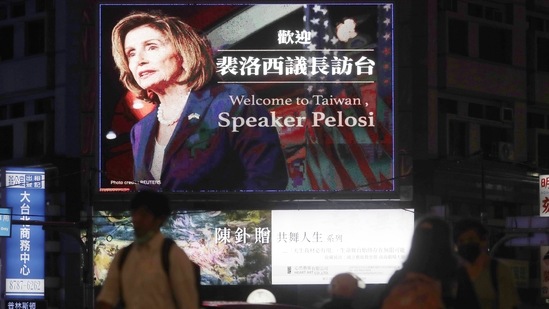 People walk past a billboard welcoming US House Speaker Nancy Pelosi, in Taipei, Taiwan.&nbsp;(AP)