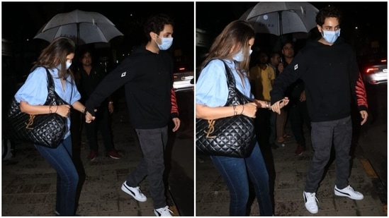 Shweta wore a light blue-coloured top featuring puffed half-length sleeves, a Mandarin collar with an open V slit and a curved hem with dark blue skinny-fit denim pants, matching pointed sandals, bracelets, a watch, and a patterned YSL black tote bag. As for Agastya, he chose a dark blue hooded sweatshirt, grey pants and white sneakers.(HT Photo/Varinder Chawla)