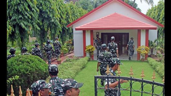 CRPF personnel stand guard outside the farmhouse, which was allegedly purchased by former West Bengal minister Partha Chatterjee and his aide, Arpita Mukherjee as ED officials searched the premises, at Bolpur subdivision of Birbhum district on Wednesday. (ANI) CRPF personnel stand guard outside the farmhouse, which was allegedly purchased by former West Bengal minister Partha Chatterjee and his aide, Arpita Mukherjee as ED officials searched the premises, at Bolpur subdivision of Birbhum district on Wednesday. (ANI)