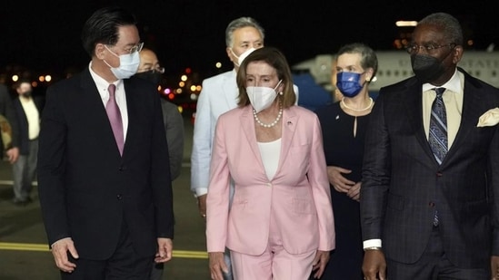 US House Speaker Nancy Pelosi (centre) arrives in Taipei, Taiwan, on Tuesday. (AP) US House Speaker Nancy Pelosi (centre) arrives in Taipei, Taiwan, on Tuesday. (AP)