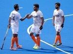 Harmanpreet Singh of India, centre, celebrates with Lalit Kumar Upadhyay of India, left, and Shamsher Singh of India after they win their hockey match(AP)