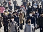 FILE PHOTO: People wearing protective face masks commute amid concerns over the new coronavirus disease (COVID-19) in Pyongyang, North Korea.