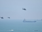 Chinese military helicopters fly past Pingtan island, one of mainland China's closest point from Taiwan, in Fujian province on Thursday. Chinese military helicopters fly past Pingtan island, one of mainland China's closest point from Taiwan, in Fujian province on Thursday.