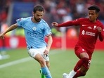 Manchester City's Bernardo Silva and Liverpool's Fabio Carvalho tussle for the ball. (Getty) Manchester City's Bernardo Silva and Liverpool's Fabio Carvalho tussle for the ball. (Getty)