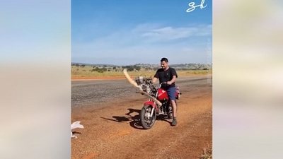 Taken from the Facebook viral video, the man is riding a motorcycle with a propeller. (Facebook/@Supercar Blondie)