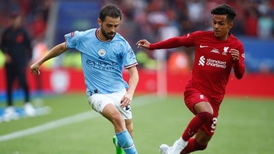 Manchester City's Bernardo Silva and Liverpool's Fabio Carvalho tussle for the ball. (Getty) Manchester City's Bernardo Silva and Liverpool's Fabio Carvalho tussle for the ball. (Getty)