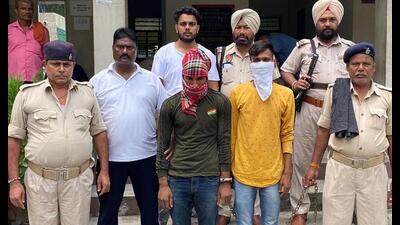 Two members of the gang involved in making extortion calls in police custody in Amritsar. Two members of the gang involved in making extortion calls in police custody in Amritsar.