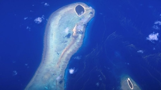 Coral surrounds two small islands on the Great Barrier Reef in Australia.((Representative Image/ REUTERS))