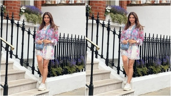 Aamna teamed her shirt with a white short skirt with elastic details at the waist and featuring floral patterns.(Instagram/@aamnasharifofficial)