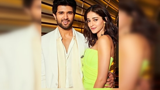 Ananya Panday donned a neon green strapless corset-inspired body-hugging dress while Vijay Devarakonda looked dapper in an all-white suit.(Instagram/@ananyapanday)