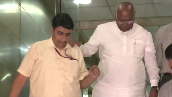 Congress MP and Leader of Opposition in Rajya Sabha Mallikarjun Kharge (R) leaves the National Herald building after he was questioned by the ED, on Thursday, August 4, 2022. (ANI Photo)