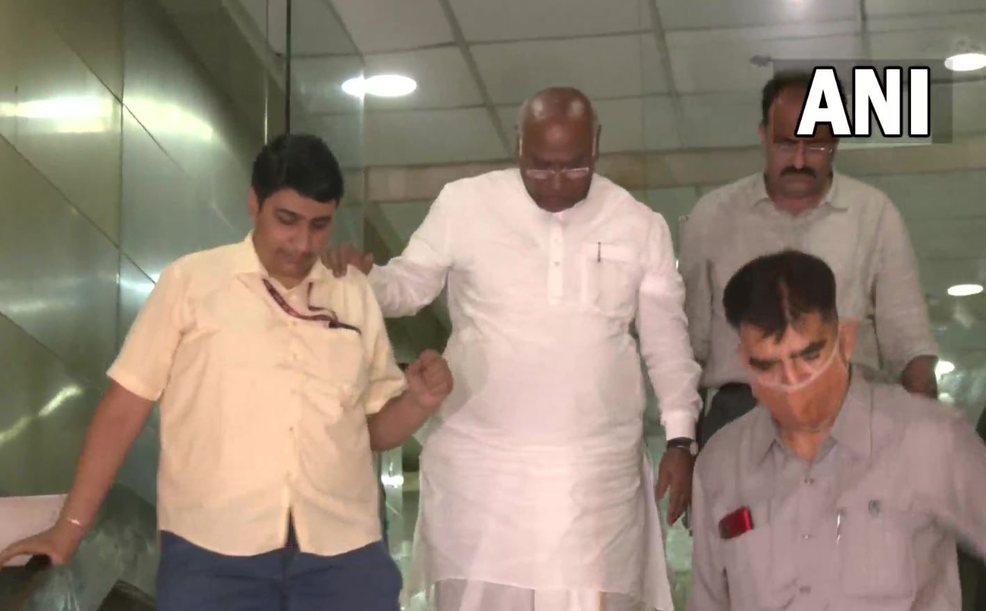 Congress MP and Leader of Opposition in Rajya Sabha Mallikarjun Kharge (R) leaves the National Herald building after he was questioned by the ED, on Thursday, August 4, 2022. (ANI Photo)