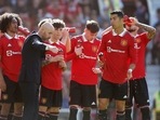 Manchester United manager Erik ten Hag speaks with Manchester United's Alejandro Garnacho and Cristiano Ronaldo