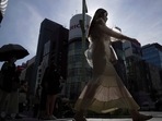 People wearing protective masks to help curb the spread of the coronavirus walk along a pedestrian crossing Monday, Aug. 1, 2022, in Tokyo.(AP) People wearing protective masks to help curb the spread of the coronavirus walk along a pedestrian crossing Monday, Aug. 1, 2022, in Tokyo.(AP)