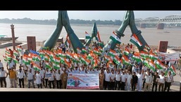 Members of Department of Posts at Namo Ghat in Varanasi after the Prabhat Pheri to promote ‘Har Ghar Tiranga’ campaign. (HT photo)