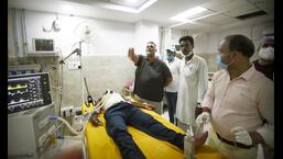 JAP president Pappu Yadav visits victims who allegedly fell ill after consuming spurious liquor, in Saran district, at PMCH on Friday. (Santosh Kumar/HT Photo)