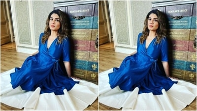 The dress cascaded featuring long flowy details and a thick white border at the ankles. The dress also featured loose pleat details below the waist. (Instagram/@officialraveenatandon)