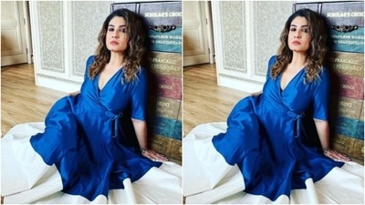 Matching the dress, Raveena further accessorised her look for the day in blue statement earrings from the shelves of Putstyle. (Instagram/@officialraveenatandon)