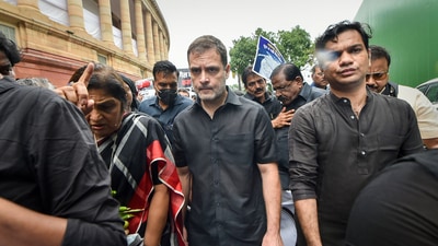 Congress leader Rahul Gandhi, wearing black clothes, along with party MPs marches towards Rashtrapati Bhawan as part of party's nationwide protest over price rise, unemployment and GST hike on essential items, in New Delhi, Friday, (PTI) Congress leader Rahul Gandhi, wearing black clothes, along with party MPs marches towards Rashtrapati Bhawan as part of party's nationwide protest over price rise, unemployment and GST hike on essential items, in New Delhi, Friday, (PTI)